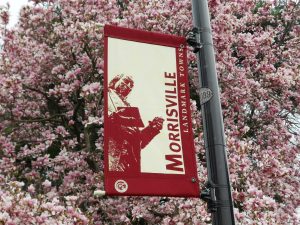 Patriotic Morrisville street sign on a light pole highlighting local same-day heating oil delivery coverage