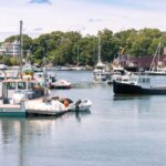 Powerboats moored at a calm bay marina on the Northeast shore