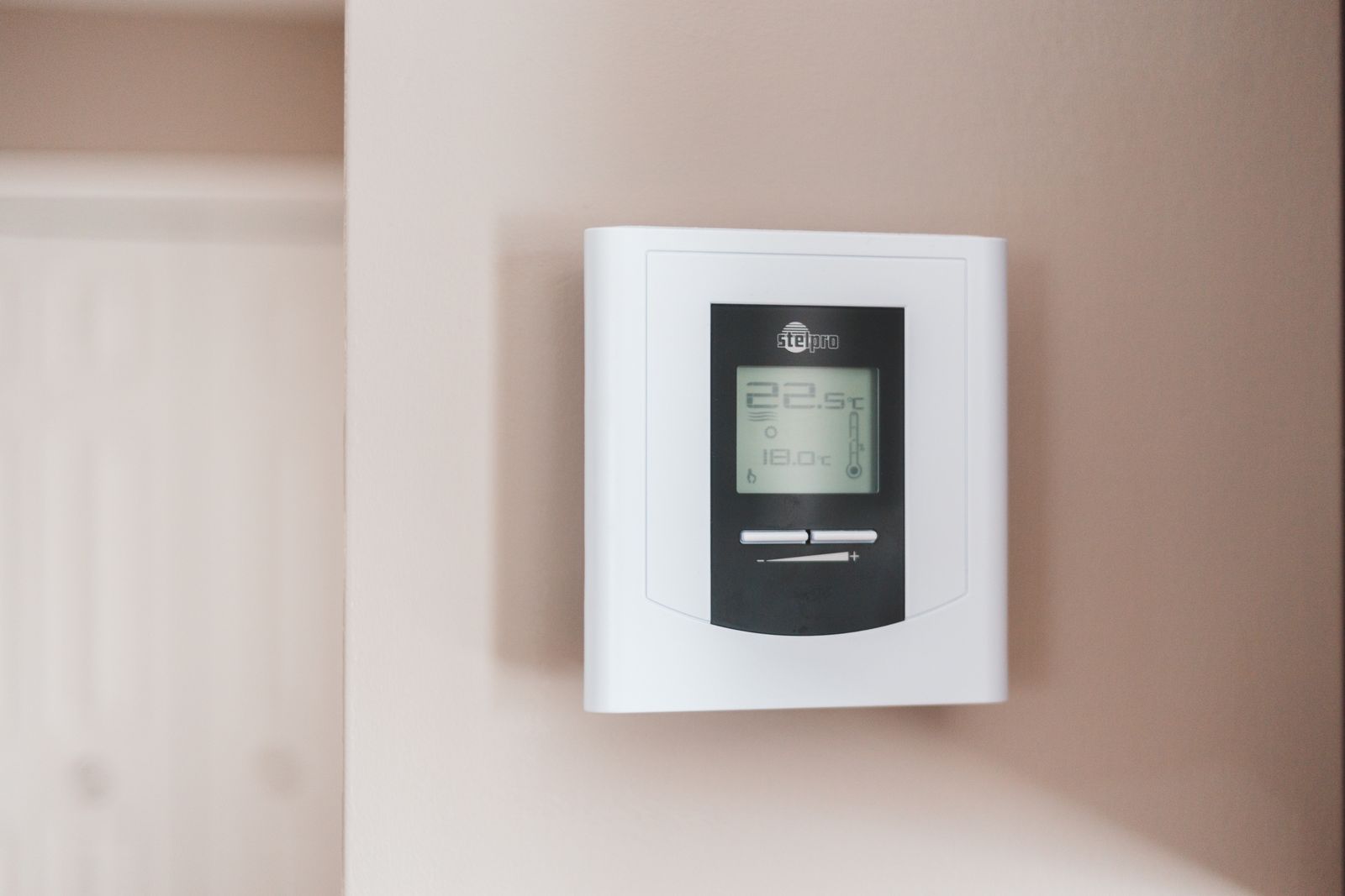Adjusting a home thermostat at the start of heating season